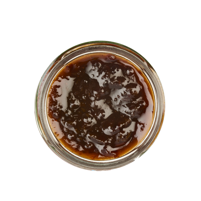 Lund Sylt marmelade pflaumenmus friesisch-open Offenes Glas mit dicker, dunkelbrauner Soße, von oben gesehen.