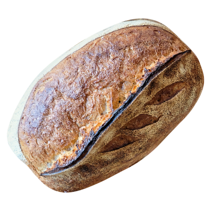 SYLTER SAUERTEIGBROT: ein goldbrauner Sauerteiglaib mit einer wunderschön eingeschnittenen Kruste.